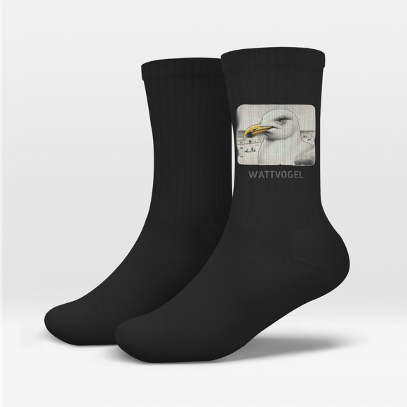 Socken Nordsee Möwe mit Strand und Touristen im Hintergrund