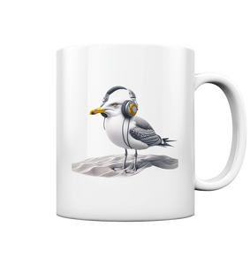 Kaffeetasse mit Druckmotiv Coole Möwe mit Kopfhörer im Sand Wattvogel
